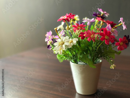 Colorful flower pot decorated on wooden table