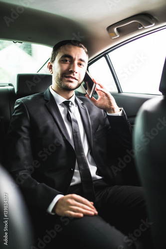 Businessman on call in car, smiling © F8  \ Suport Ukraine