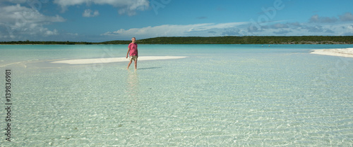 Man on a sand bank, Bahamas