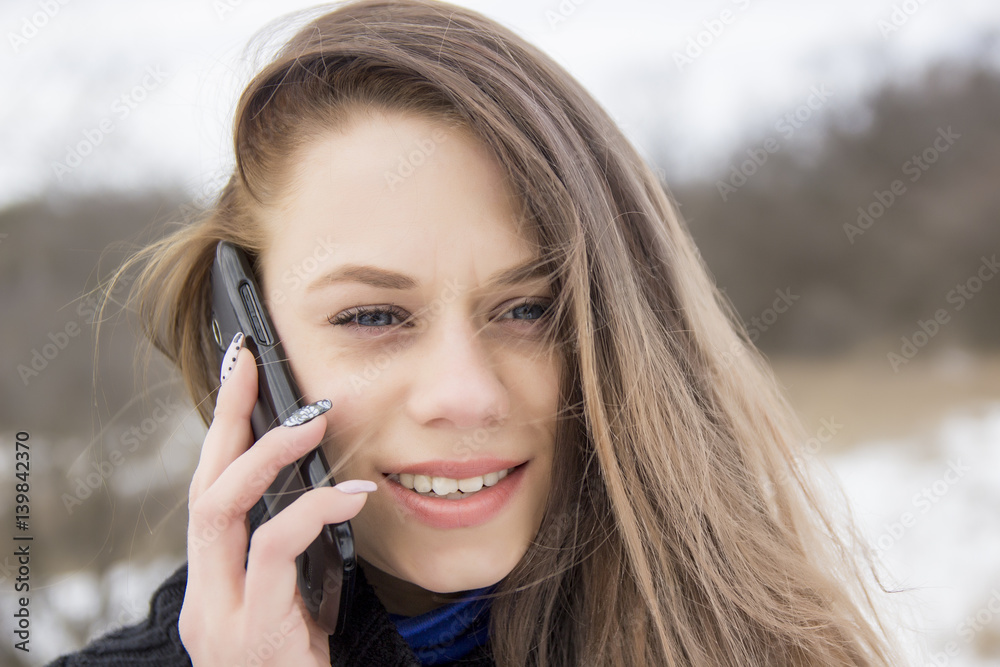 Beautiful young girl speaks by phone Beautiful young girl speaks by phone