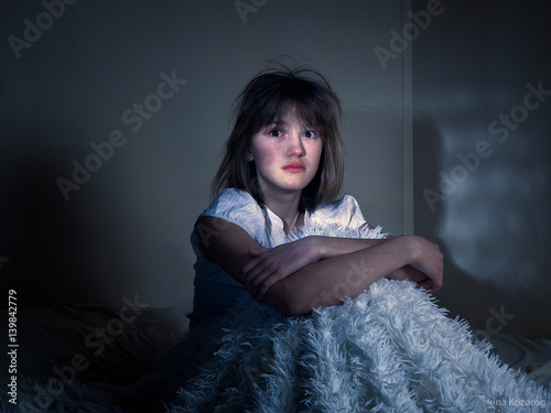 The scared girl in bed for the night