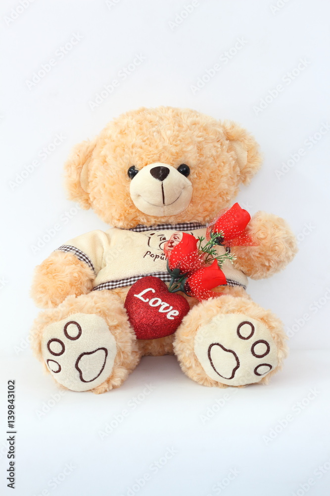 Brown teddy bears and red roses on a white background. Brown teddy bears and red roses on a white background.