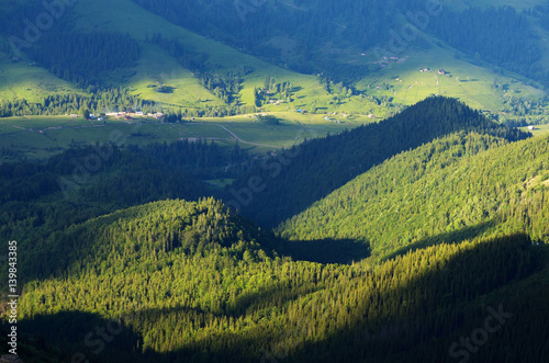 Summer landscape with a village in a mountain valley