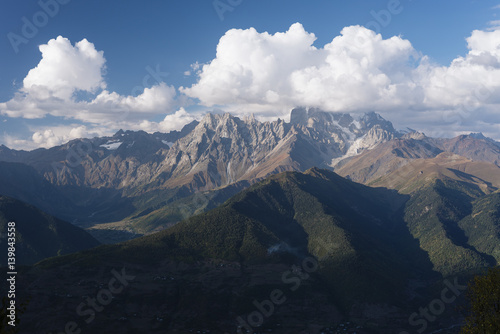 Mountainous landscape of Svaneti with peak Ushba in the clouds
