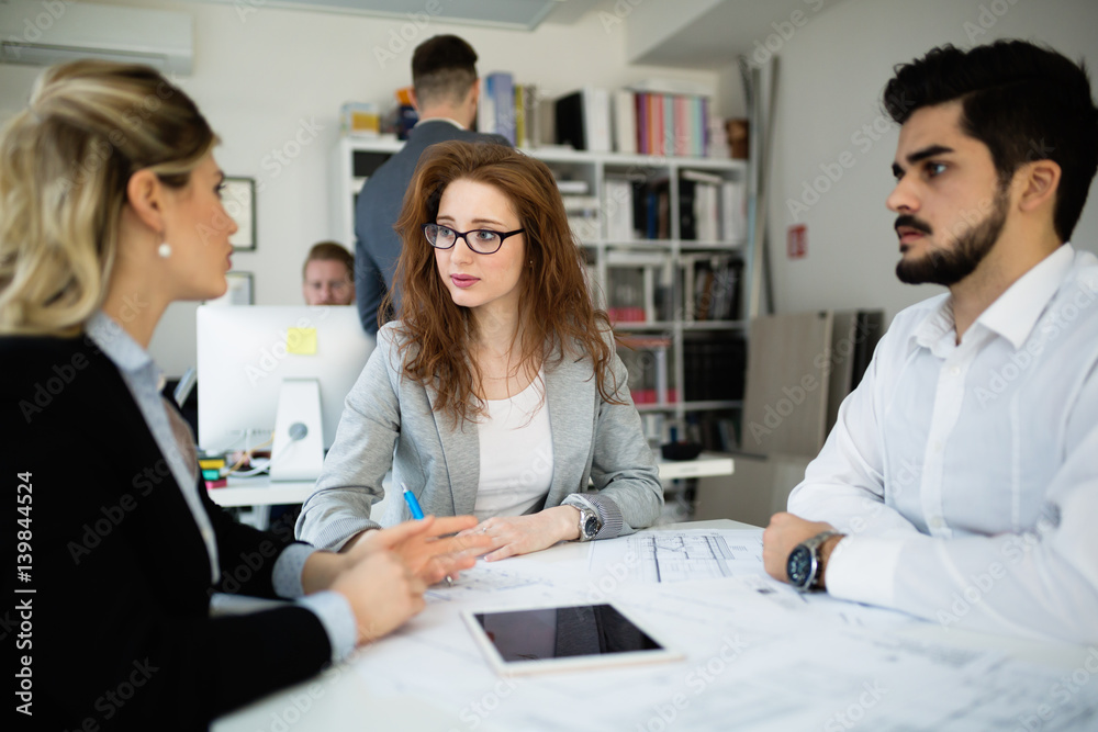 Fototapeta premium Business people and architects collaborating on project