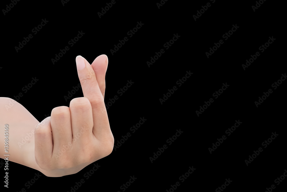 a left hand of woman show mini heart sign for love in valentine day isolated on black background a left hand of woman show mini heart sign for love in valentine day isolated on black background