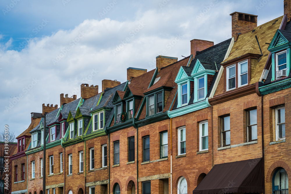Fototapeta premium Architectural details of row houses in the Station North Arts and Entertainment District, in Baltimore, Maryland.
