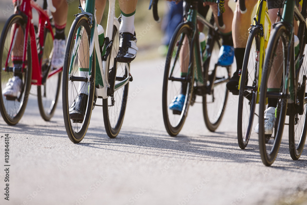 Fototapeta premium Group of cyclists riding a bike in a cycling race. Racing Bike.
