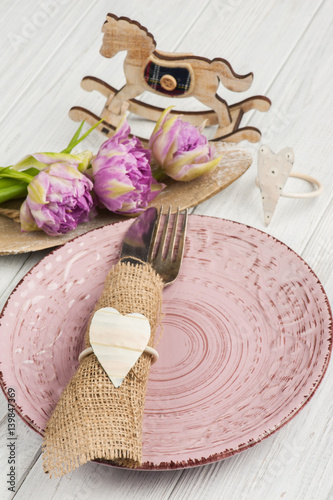 Fork and knife in burlap napkin