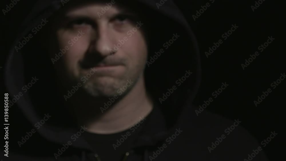 Hooded Man Walks Up and Points Gun and Motions to Side. a hooded man walks out of the darkness towards the camera, lifts gun and motions to move over with the gun. Racks to gun in slow motion.
Hooded Man Walks Up and Points Gun and Motions to Side. a hooded man walks out of the darkness towards the camera, lifts gun and motions to move over with the gun. Racks to gun in slow motion.