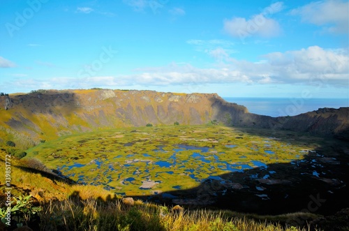 Long shot of Rano Kau a large volcanic crater containing a freshwater lake in Easter Island, Rapa Nui, Chile, South America © mandy2110