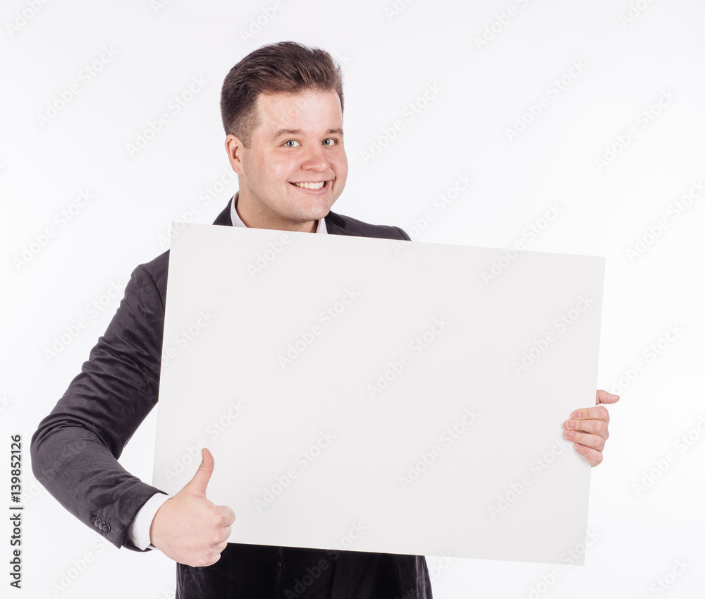 young man holding white blank panel with space for text on white background. young man holding white blank panel with space for text on white background.