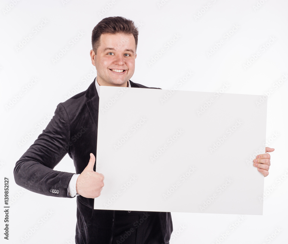 young man holding white blank panel with space for text on white background. young man holding white blank panel with space for text on white background.