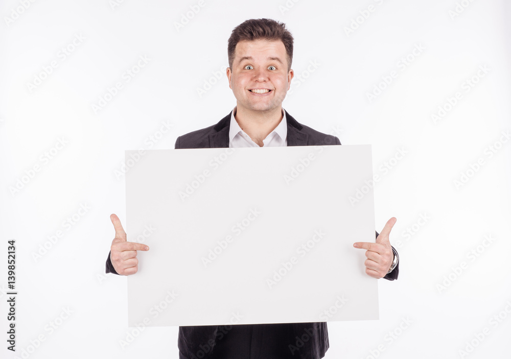 young man holding white blank panel with space for text on white background. young man holding white blank panel with space for text on white background.