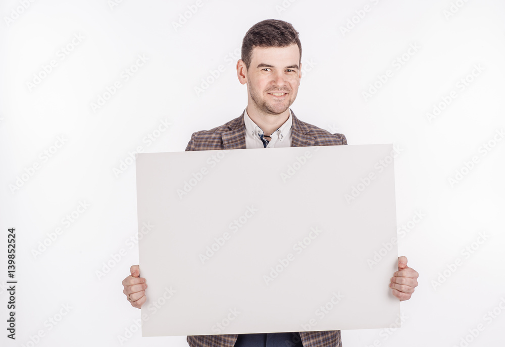 young man holding white blank panel with space for text on white background. young man holding white blank panel with space for text on white background.