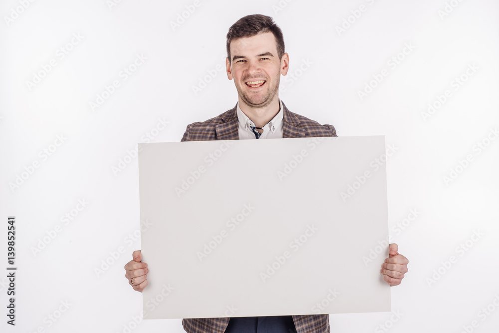 young man holding white blank panel with space for text on white background. young man holding white blank panel with space for text on white background.