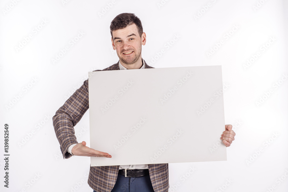 young man holding white blank panel with space for text on white background. young man holding white blank panel with space for text on white background.