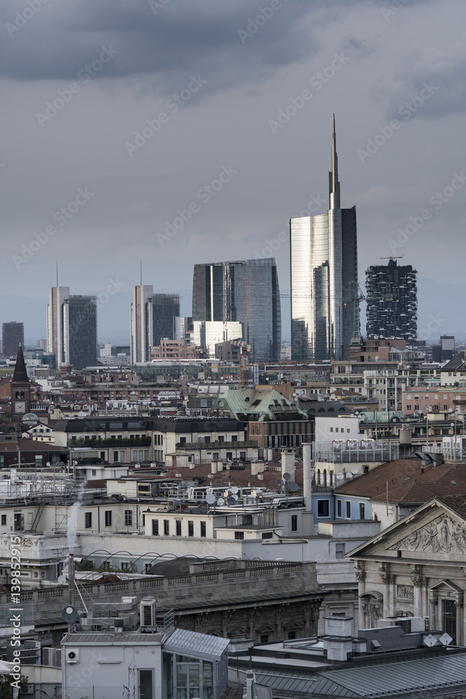 Milan panoramic skyline with new modern skyscrapers in Porta Nuova business district in Milan, Italy. The picture was taken from the roof of Duomo cathedral. Milan panoramic skyline with new modern skyscrapers in Porta Nuova business district in Milan, Italy. The picture was taken from the roof of Duomo cathedral.