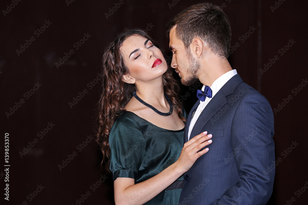 Beautiful elegant couple on dark background Beautiful elegant couple on dark background