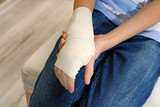 Closeup of girl with bandage on her hand