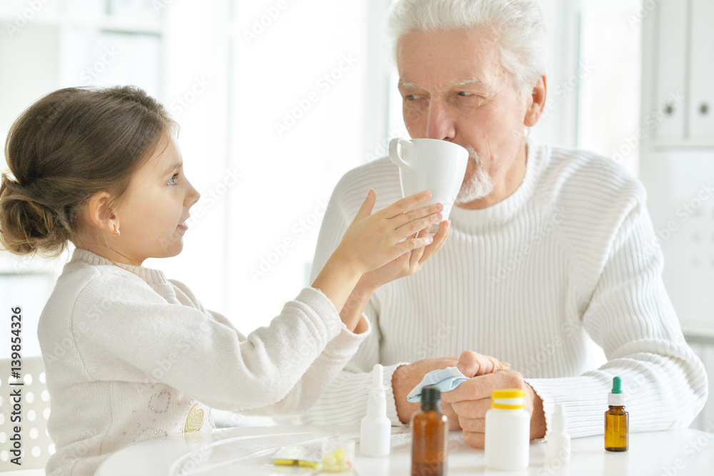 Granddaughter takes care of a sick grandfather Granddaughter takes care of a sick grandfather