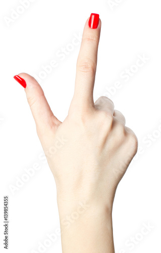 Canvas Print close-up of woman's hand with red nails pointing  index finger on white background