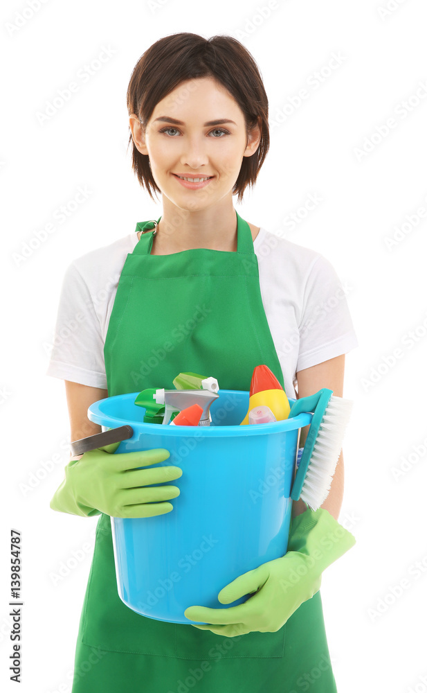 Young woman holding bucket with cleaning supplies on white background Young woman holding bucket with cleaning supplies on white background