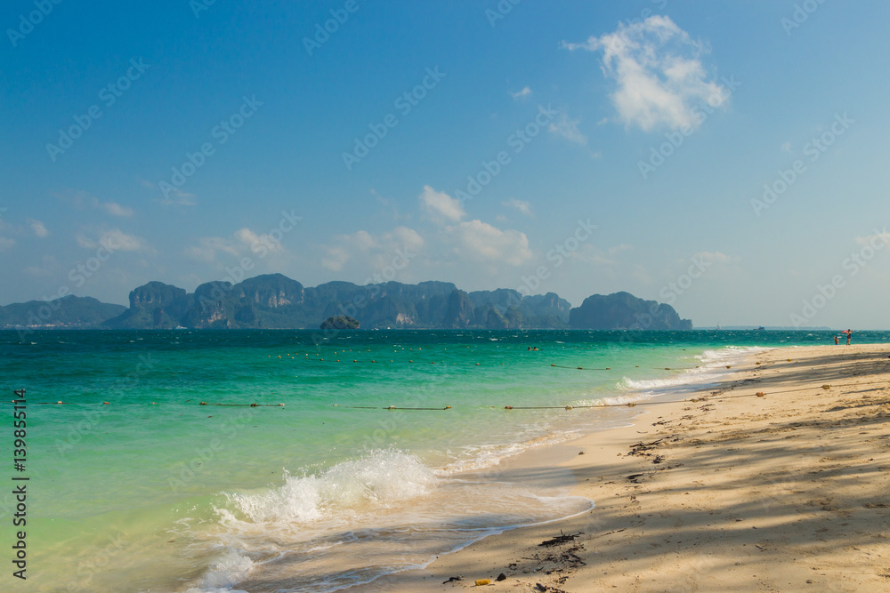 Clear water and blue sky, Poda island beach in Krabi province, Thailand.