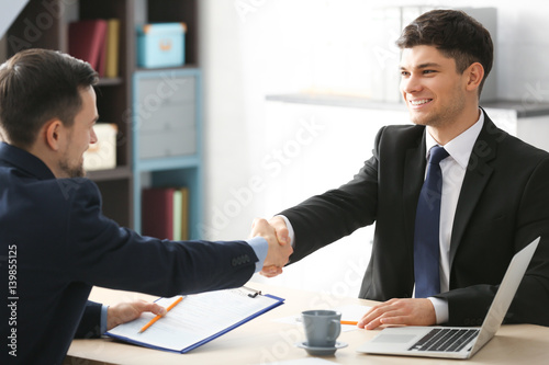 HR manager shaking hands wi...