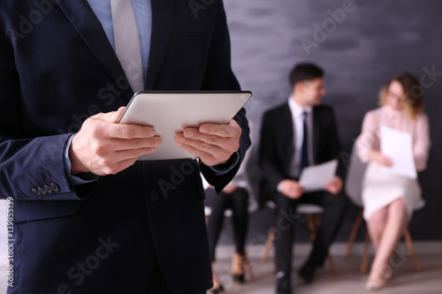 Male hands holding tablet a...
