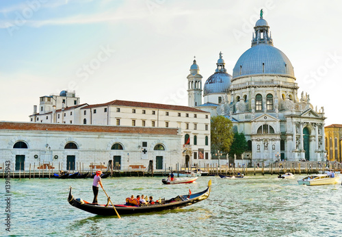 View of the Basilica of Saint Mary of Health with Gondolas on the Grand Canal in Venice © Javen