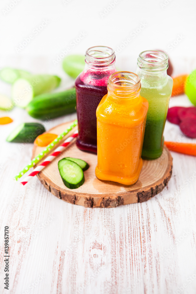 Freshly squeezed vegetable juice in bottles, useful vitamin cocktail, detox diet, selective focus Freshly squeezed vegetable juice in bottles, useful vitamin cocktail, detox diet, selective focus
