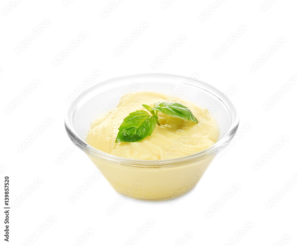Creamy cheese and basil leaves in glass bowl, isolated on white Creamy cheese and basil leaves in glass bowl, isolated on white