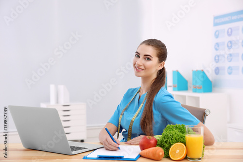 Young female nutritionist i...