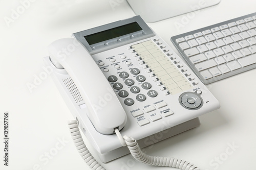 Telephone on table of technical support agent in office