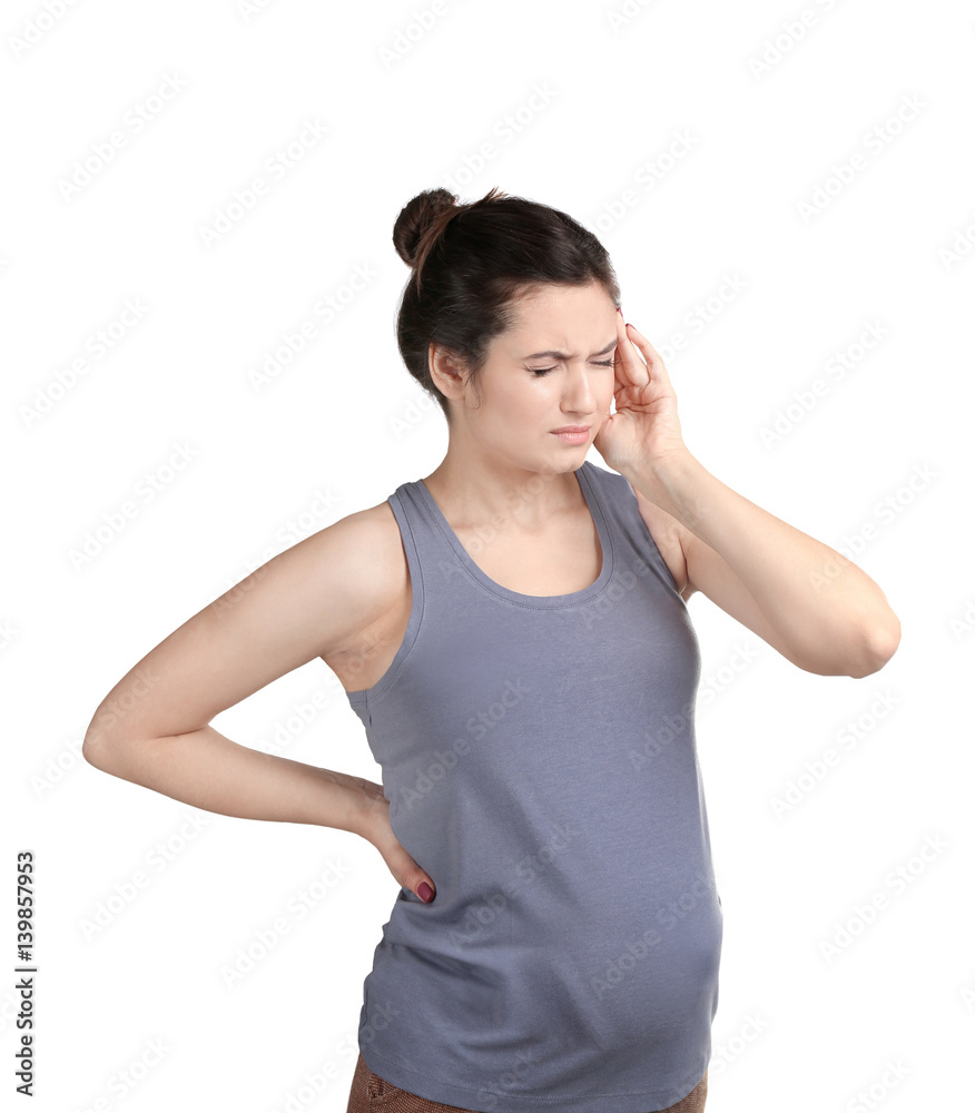 Young pregnant woman suffering from headache on white background Young pregnant woman suffering from headache on white background