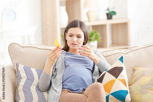 Young pregnant woman going ...