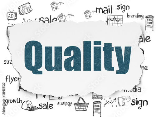 Marketing concept  Quality on Torn Paper background