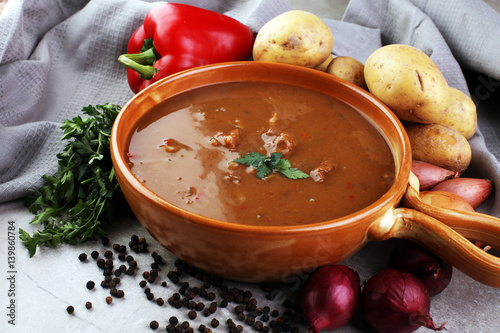 Tasty Hungarian beef goulash soup bograch close-up on the table and ingredient photo