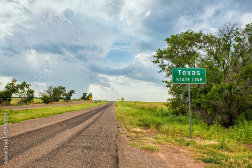 Texas Stateline sign next to historic Route 66 near the town of Texola, Oklahoma