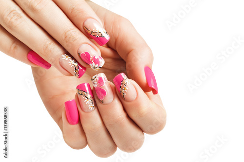 Nail art manicure  with a pattern of flowers and hearts. Isolated.