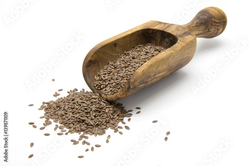 Flaxseeds in wooden scoop