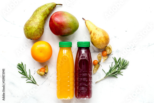multifruit juice in plastic bottle on white background top view mock-up