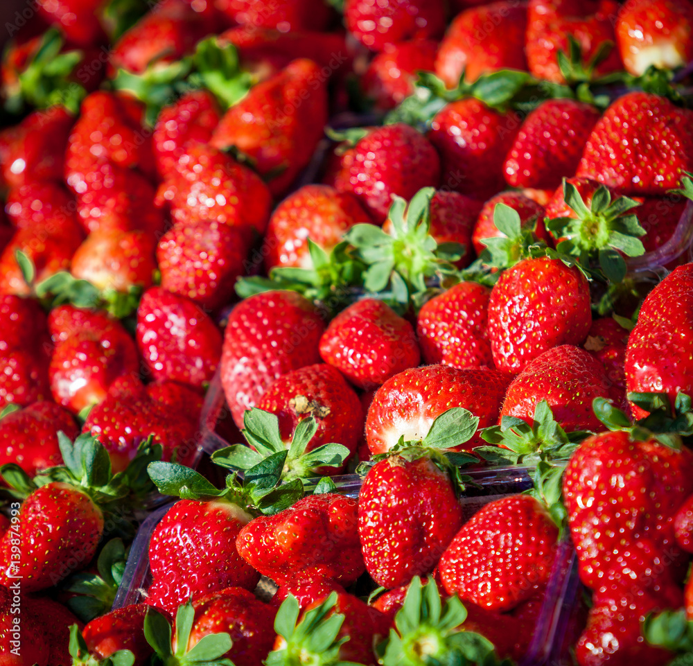 red strawberries in baskets for sale at market. Many fresh strawberries for sale. Lots of strawberries red strawberries in baskets for sale at market. Many fresh strawberries for sale. Lots of strawberries