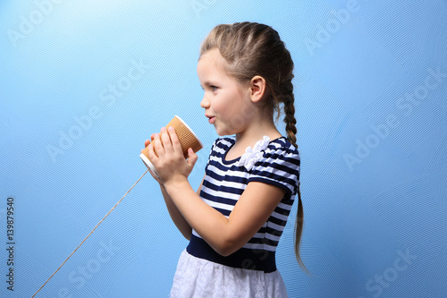 Cute little girl using plas...
