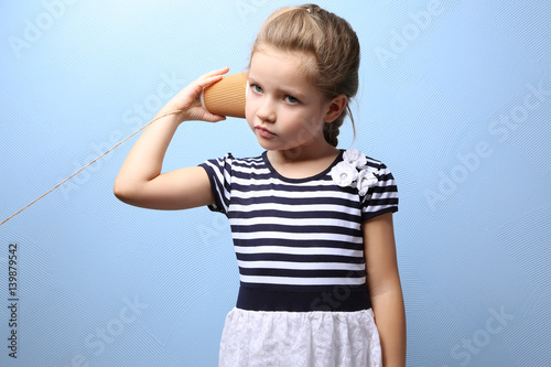 Cute little girl using plas...