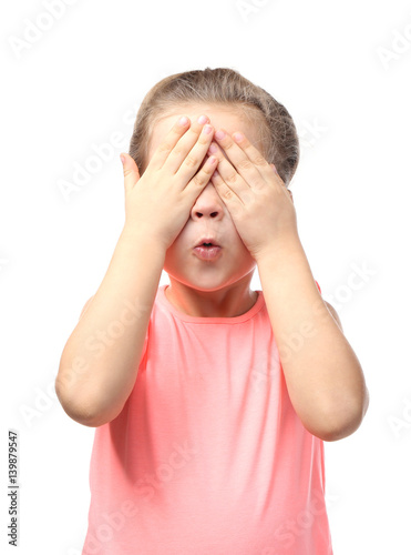 Cute little girl covering e...