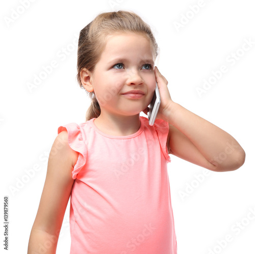 Cute little girl talking by...