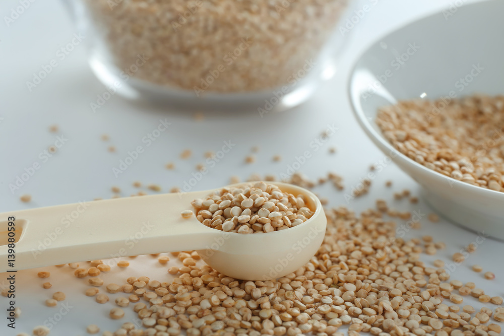 Organic quinoa seeds on white background