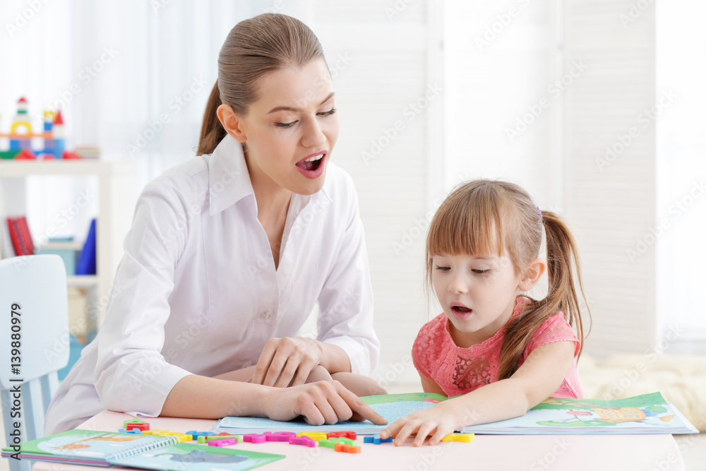 Cute little girl at speech therapist office Cute little girl at speech therapist office